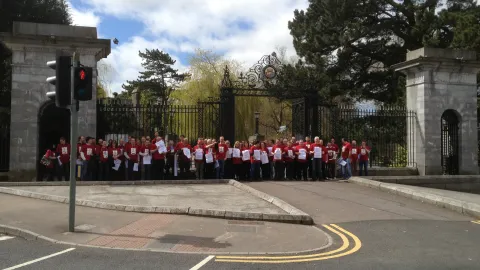 Tyndall based UCC staff campaigning outside the main gates of UCC